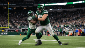 New York Jets guard Alijah Vera-Tucker injury in action blocking during an NFL game at MetLife Stadium.