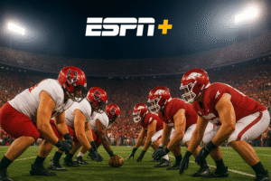 AR State vs Arkansas football game action, showing players on the field during the Razorbacks match.