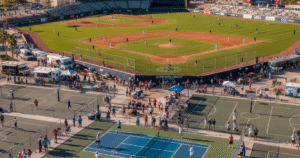 Kino Sports Complex in Tucson, Arizona with baseball and soccer fields, Pickleball courts, and spectators enjoying a sunny day
